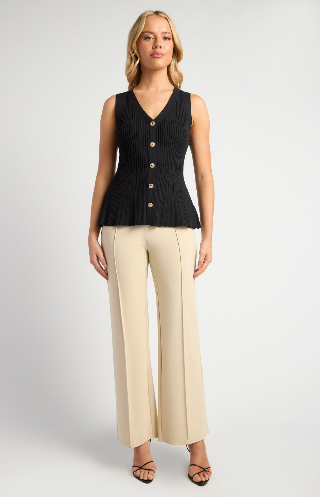 black peplum knit vest top v neckline fitted bodice