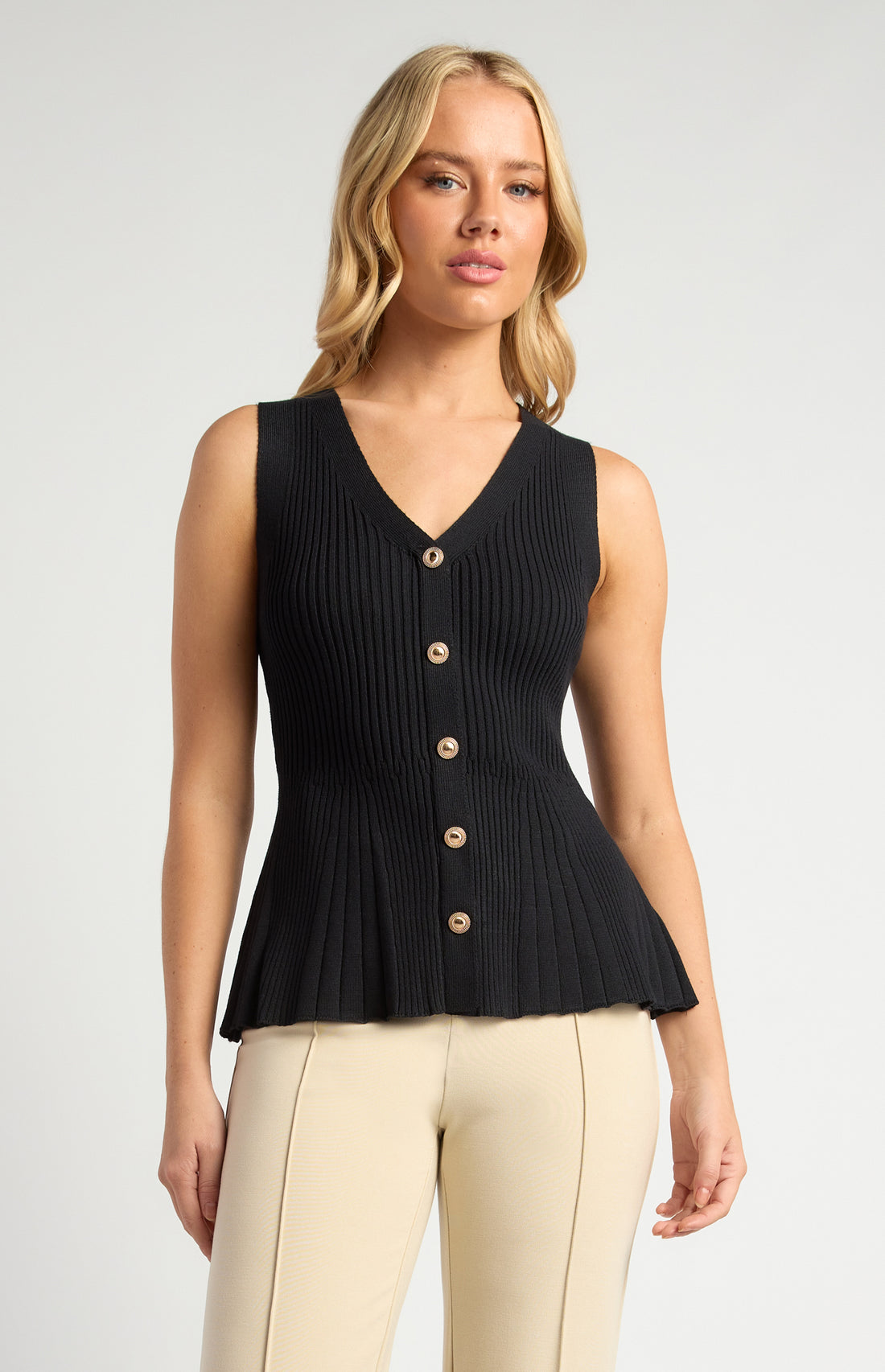 black peplum knit vest top v neckline fitted bodice
