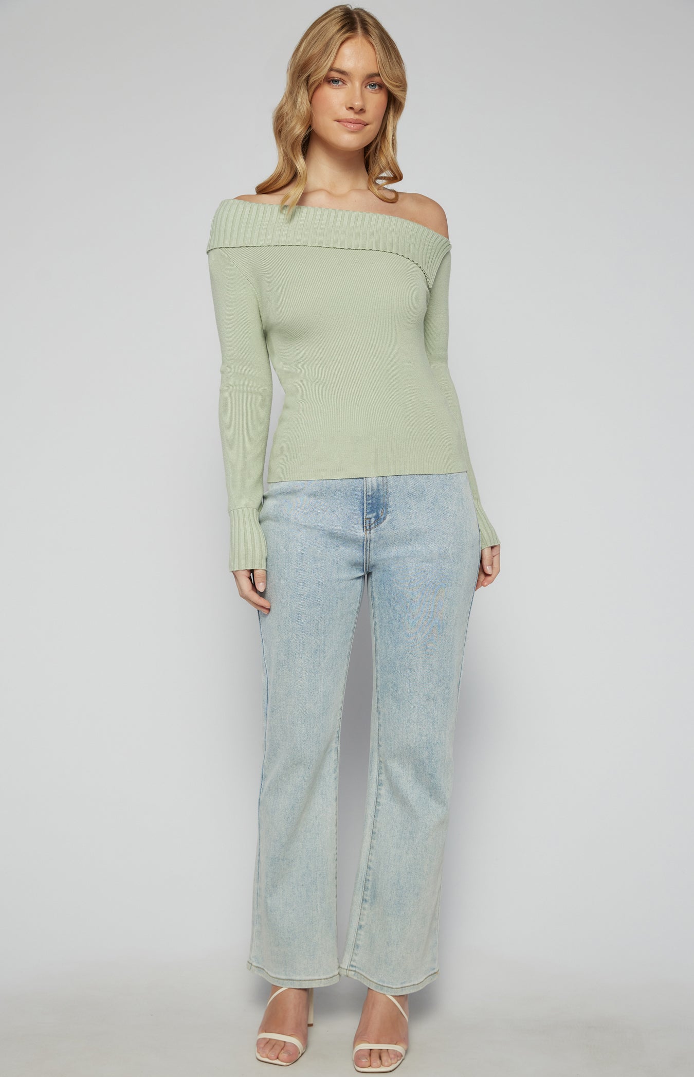 women wearing sage green one shoulder knit top